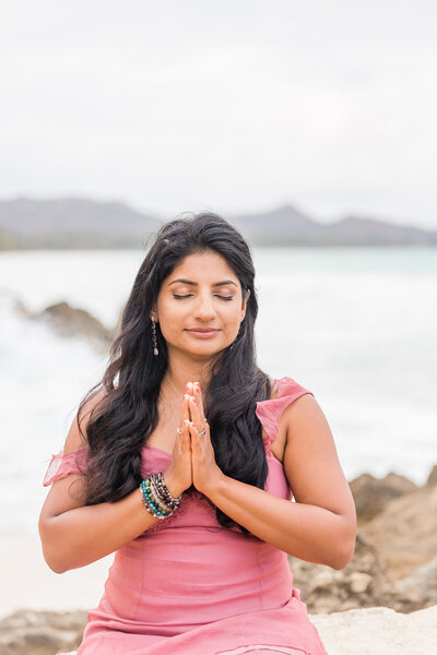Mindfulness coach Radhika meditating outside