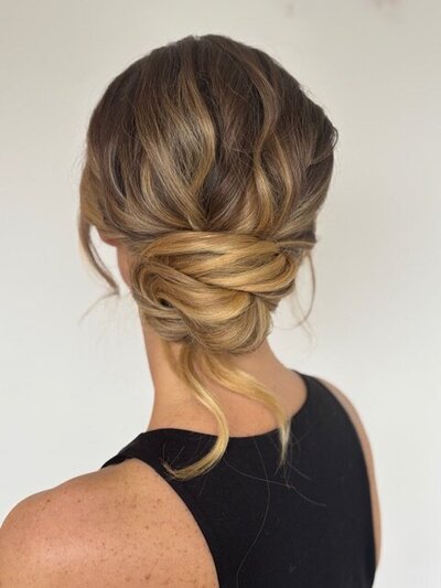 Textured low bun with tendrils for beautiful bride at Grittleton House, Wiltshire