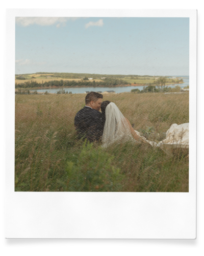 bride and groom embrace on wedding day in pei