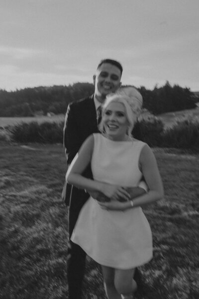 Bride and groom laughing at their ORegon wedding