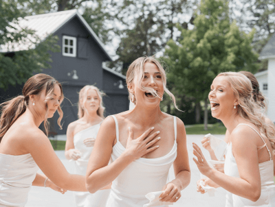 A group of women, a bride and her bridesmaids getting ready