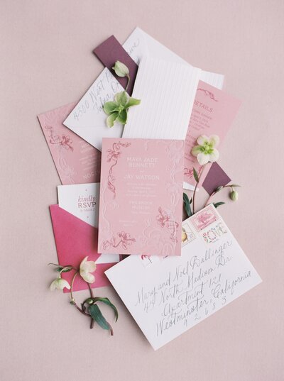 Pink invitation flatlay
