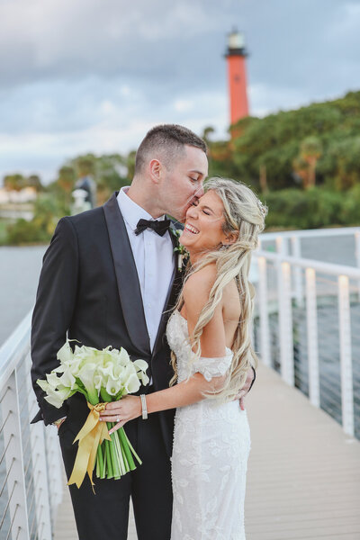 florida-bride-groom-kissing-pier