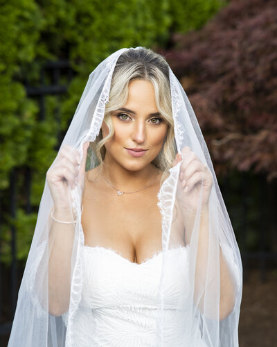 Bride in her veil at her backyard wedding