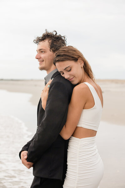 Couple's engagement portrait on the beach in Wrightsville, North Carolina