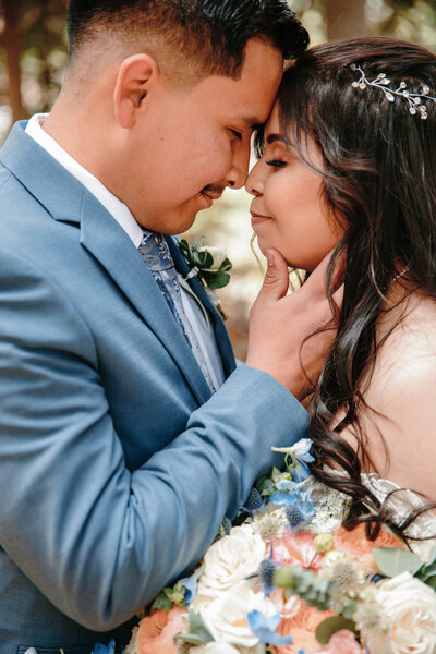 bride and groom esquimo kiss in the mountains of silverthorne colorado