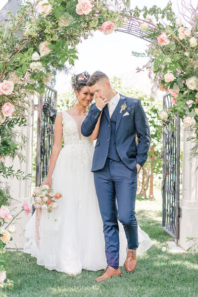 a groom kisses the back of his brides hand at their sacramento wedding.