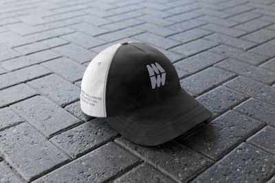 A sleek uniform hat featuring the Meg Williamson Architectural Production logo. The industrial-style MW design adds a professional touch, representing the brand’s focus on high-end architectural photography and production.