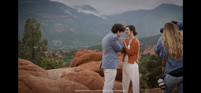 Elopement photographer photographing an elopement in the Rocky Mountains