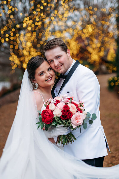 christmas wedding couples portrait with veil at black fox farms venue in cleveland tn