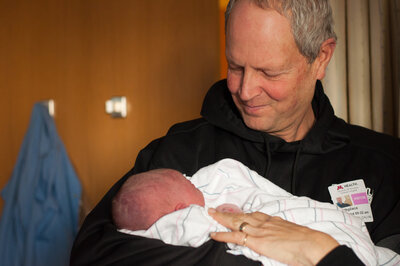 man holding new grandson