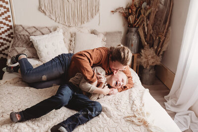 Getting giggles out of a pre-teen boy during a momma and me photo shoot for your own children can be a task, but Nikii gets some cherished keepsakes with her own children in her studio.