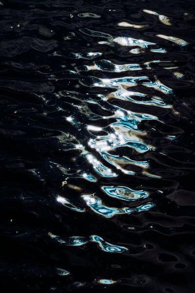 Fine Art Work of a woman lying on a stone in the water