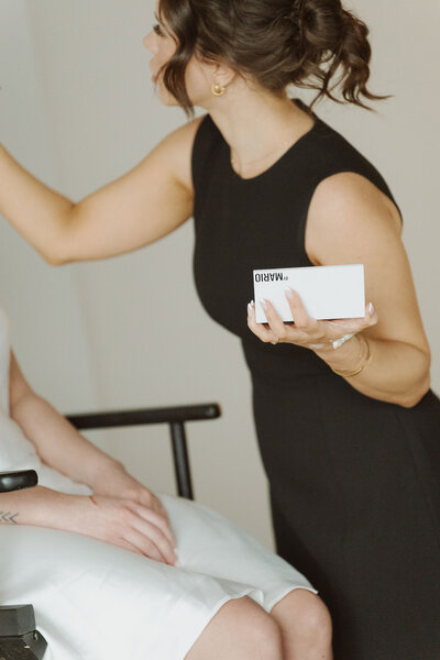 Makeup artist applying makeup.