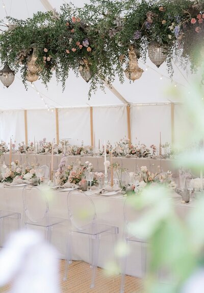 Dinner table with florals for tented wedding