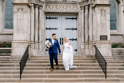 Bride & Groom walking out of their canton ohio wedding. Wedding Coordinator Sirpilla Soirees