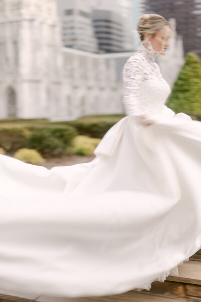 Photo of a bride swaying her dress with motion blur
