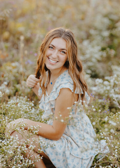 woman posing in flower field