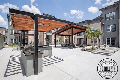 Resort style pool and outdoor grilling area at Mirabella Apartments in McAllen Texas, highlighting the well maintained amenities and resident experience supported by WLS Interests management.