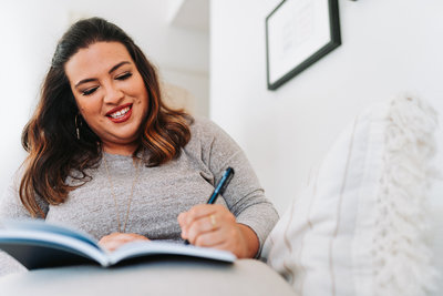 photographer writing in journal