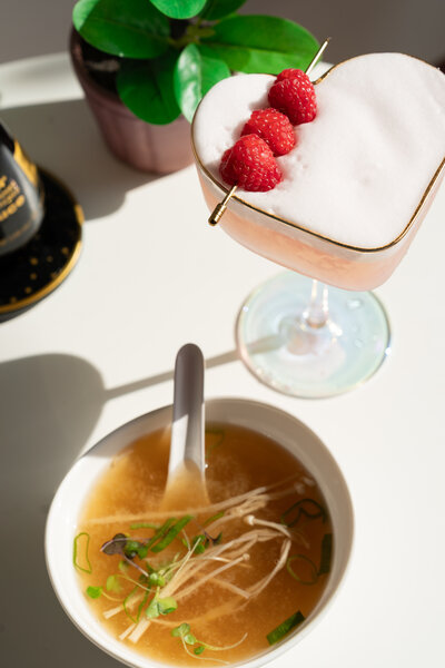 Signature ramen bowl and craft drink at Dang Good Sushi in New Port Richey, Florida — photographed by Lux Content Co. for restaurant branding.