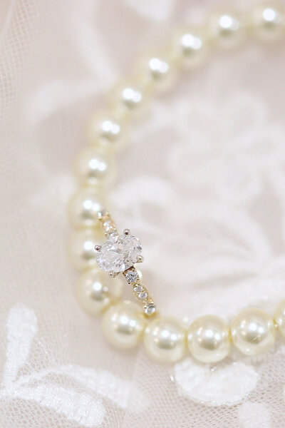 Pearl necklace with wedding ring