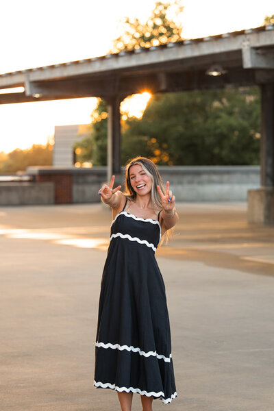 Candid behind-the-scenes photo of Briana Jewell photographing a Wichita Kansas wedding day moment
