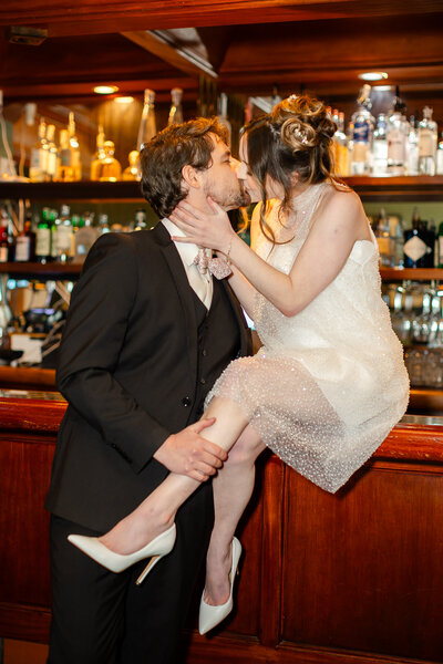 Couples kissing at the bar