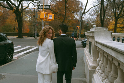 bride and groom walking in NYC elopement photos shot by Elsie Goodman Photography | NYC Elopement Packages