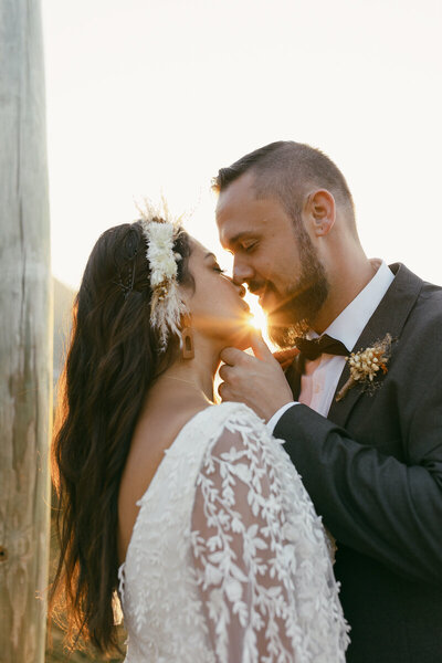 bride and groom kissing at elopement
