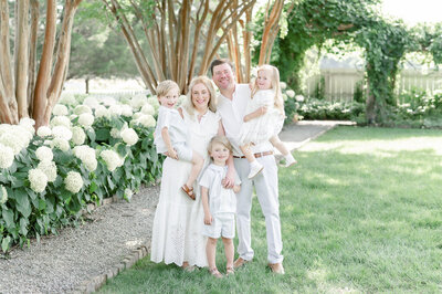 family laughing together in field