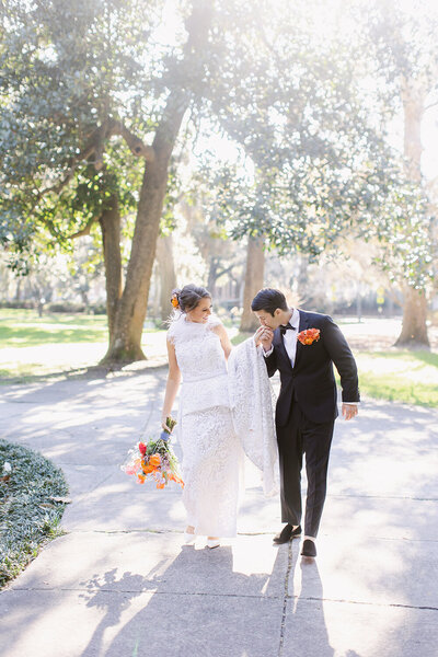 Groom kissing brides hand at the Westin Savannah