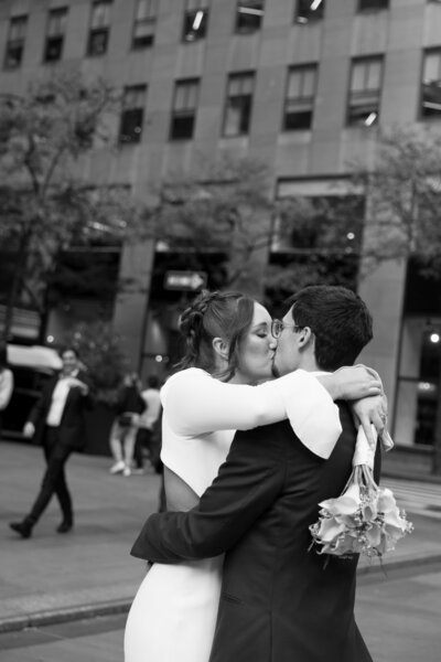 Bride and Groom kissing at Rockefeller Center NYC