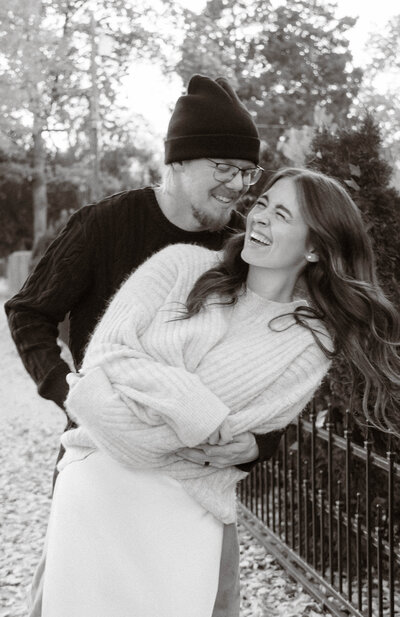 Couple walking hand in hand through Harrison Blvd in Boise Idaho