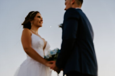 Bride getting solo portraits on her multi day elopement in Santorini Greece