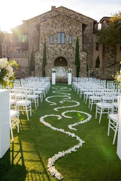 Gorgeous wedding aisle with a path of white flowers