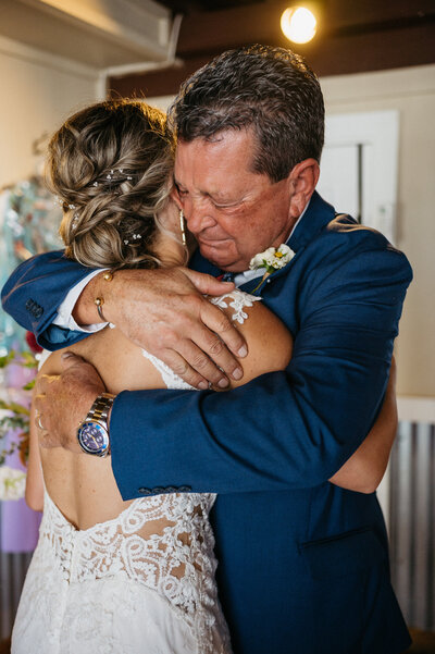 Dad hugging Bride