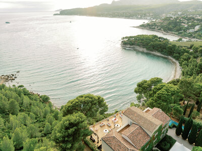 Lindy and Adam, Provence Wedding Couple in front of the arch of flowers