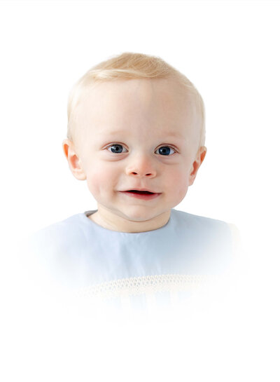 toddler boy in heirloom outfit posing for heirloom photography in a dothan alabama photography studio