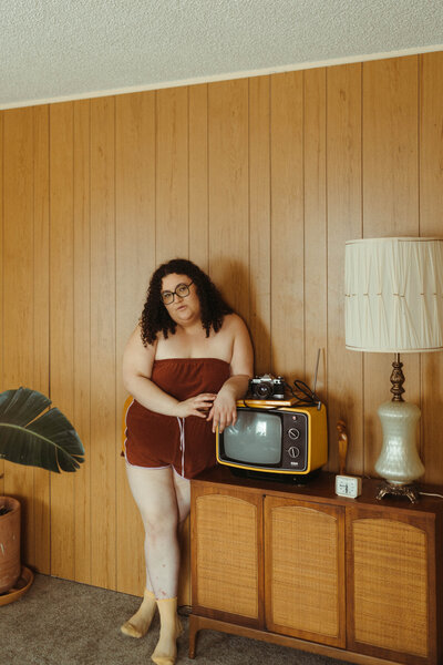 woman standing in a retro living room