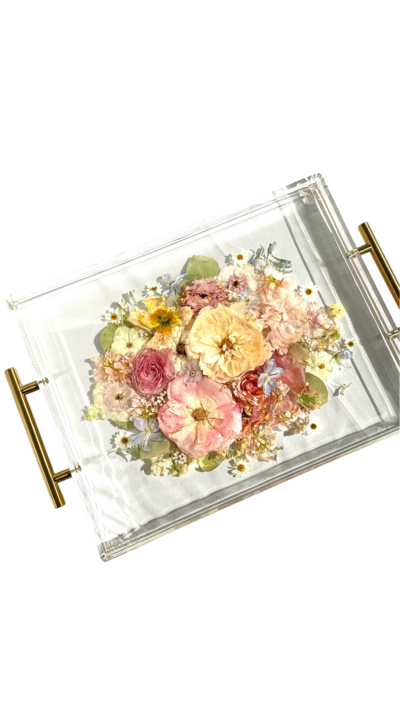 bride and groom kissing outside LDS temple bride holding light pink roes bouquet