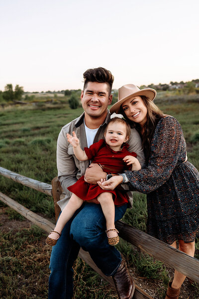 fall family photos in windsor colorado with their baby girl
