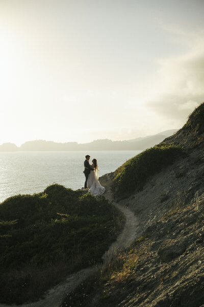 Bride and Groom on ciffs of San Francisco