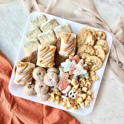 Cake cups with pumpkin cake, cream cheese frosting, and pumpkin spice pepitas.