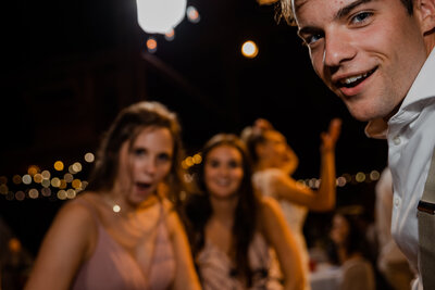 Wedding guests look into camera.