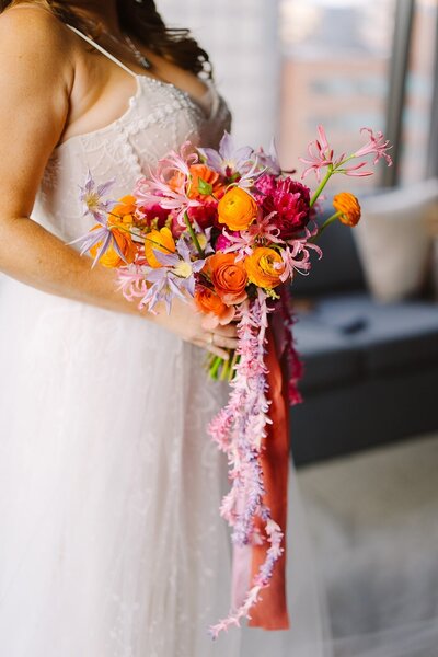 A rectangular arch with colorful ribbons on it.