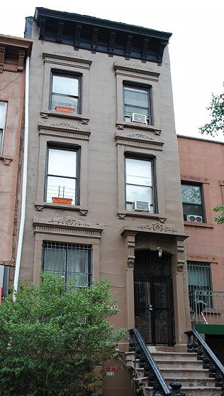 Stately brownstone building in Brooklyn with a classic facade and ornate details.