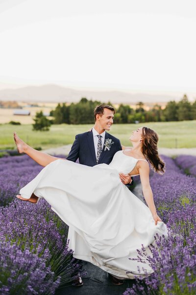 Couple kissing in a field of Lavender at their wedding in Deer Park at Lavender Manor