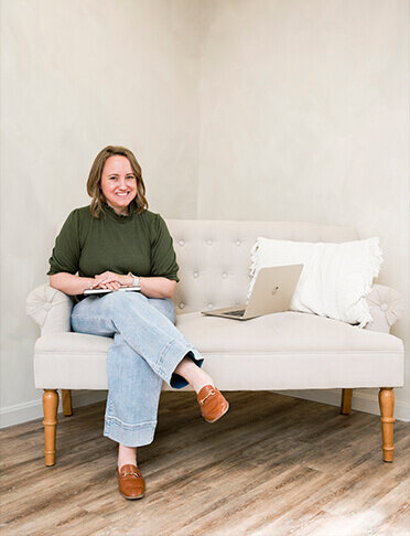 social media manager sitting in a chair in annapolis studio