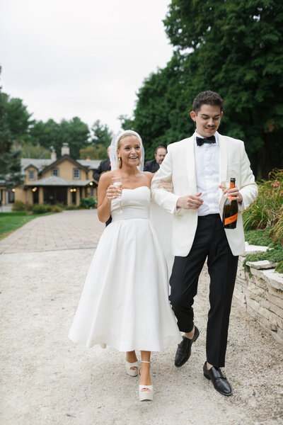 Bride and groom walking down the steps on wedding day